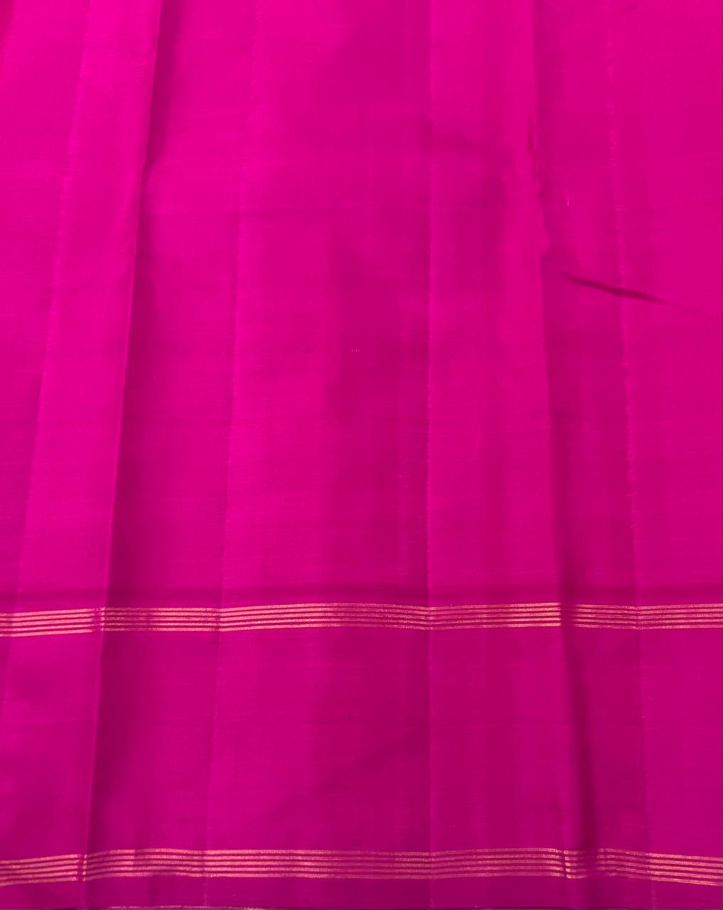 Orange Kanchipuram Silk Saree with a Contrast Pink Zari Border